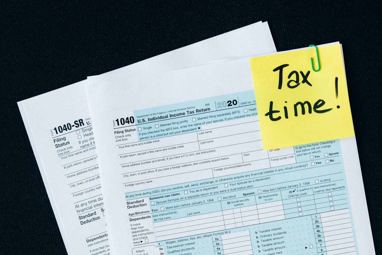 about-us U.S. tax documents with a 'Tax time!' reminder, highlighting the importance of filing deadlines.